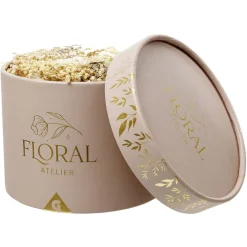 Fleur séchées dans boîte ronde rose doré