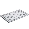 Tapis vinyle rectangulaire motif carreau de ciment fleur blanc et noir 38x60cm